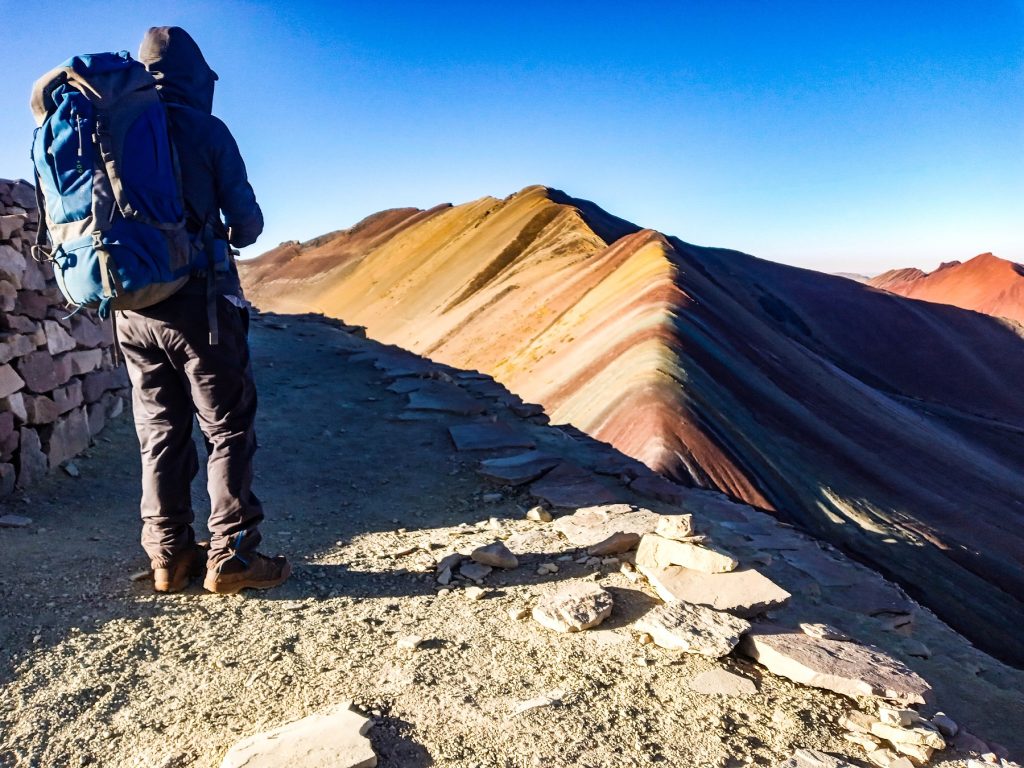 Colorful sunrise over Rainbow Mountain Vinicunca in the Andes of Peru