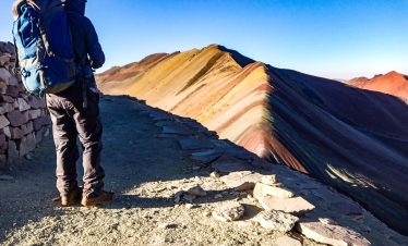 Colorful sunrise over Rainbow Mountain Vinicunca in the Andes of Peru