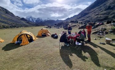 Trekking group camping under the stars on Ausangate route