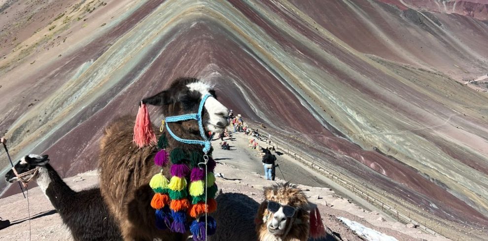 Hikers reaching the summit of Rainbow Mountain (Vinicunca), Peru