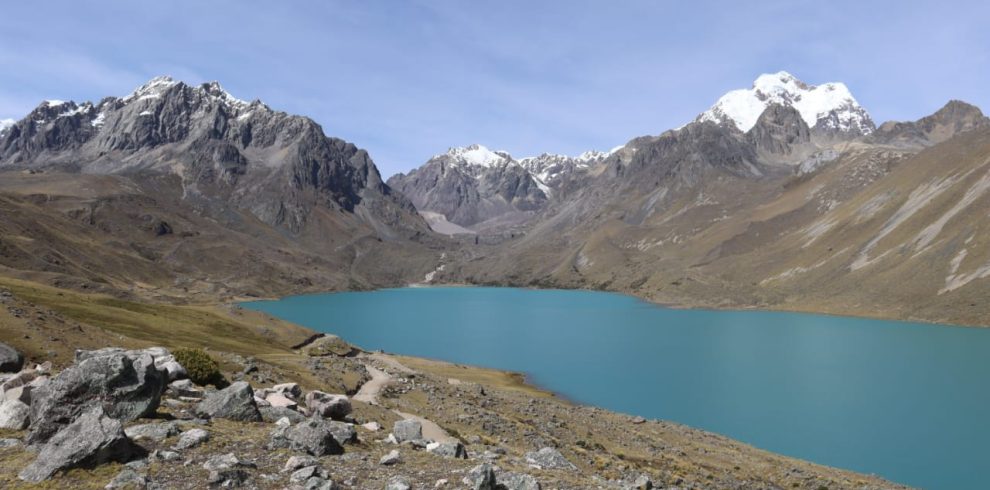 Stunning reflections on the turquoise waters of Singrenacocha Lagoon in the Andes